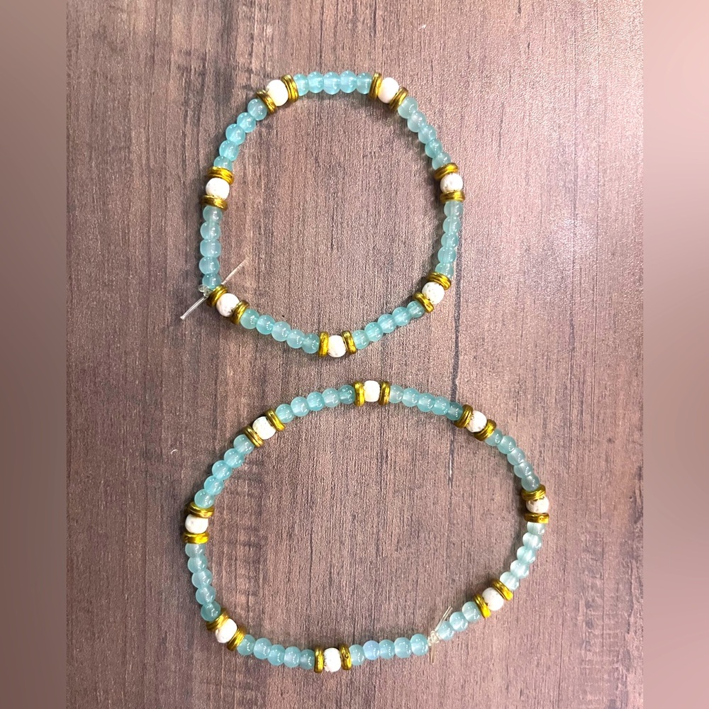 Handmade gold beaded bracelet and anklet with white and green beads.